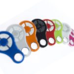 Assorted colorful Key Automation wireless remote controls in blue, white, orange, black, red, green, and gray, displayed in Prestons, New South Wales, Australia.