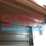 Roller garage door with automatic door opener and digital controls by SAMT in Prestons, New South Wales, Australia.